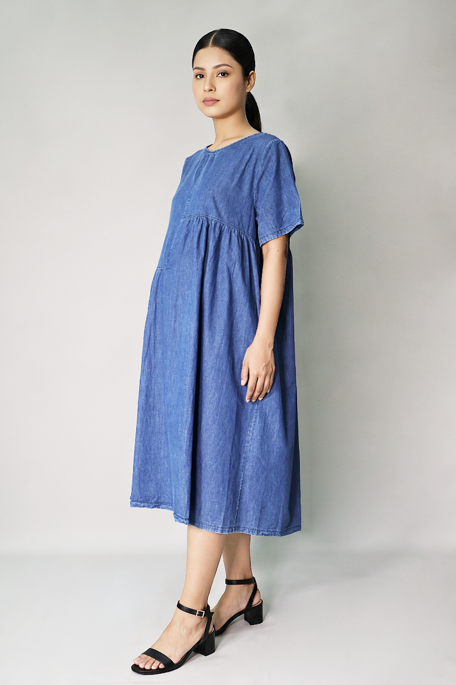 Bump-friendly cotton denim gathered maternity dress side view