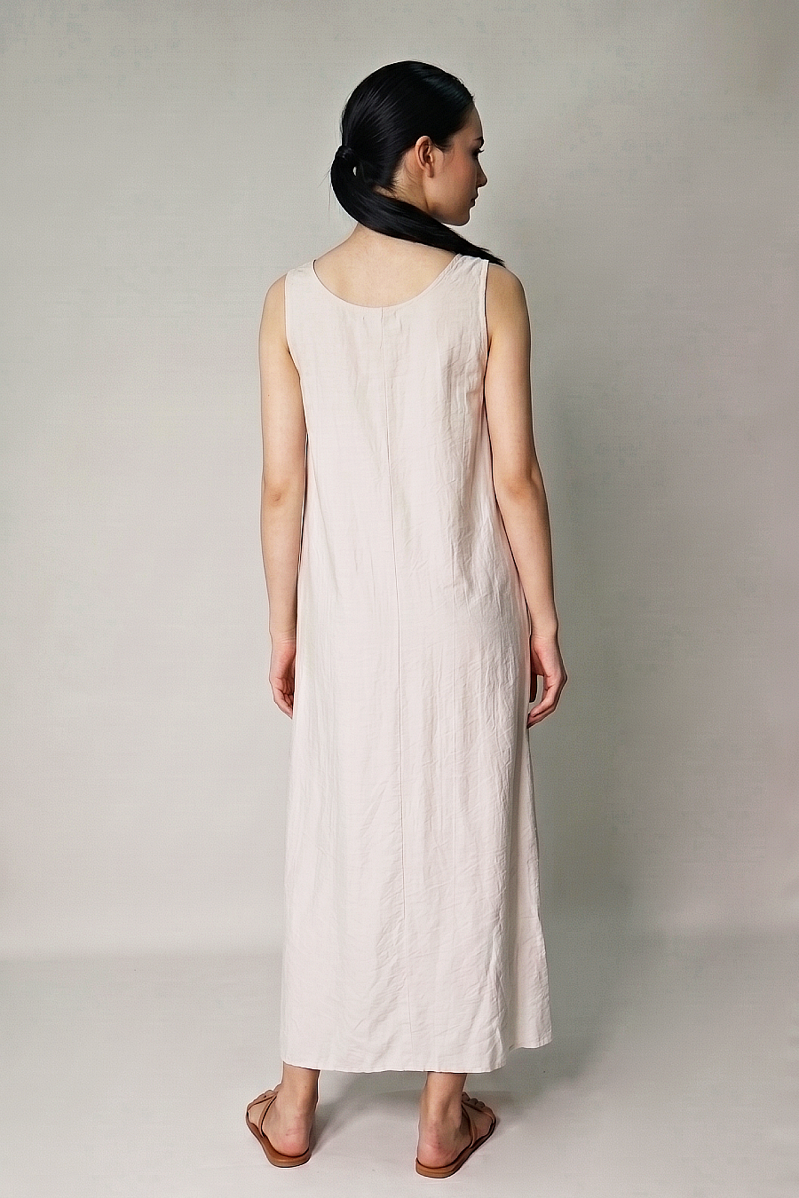 Beige sleeveless maternity maxi dress relaxed back view