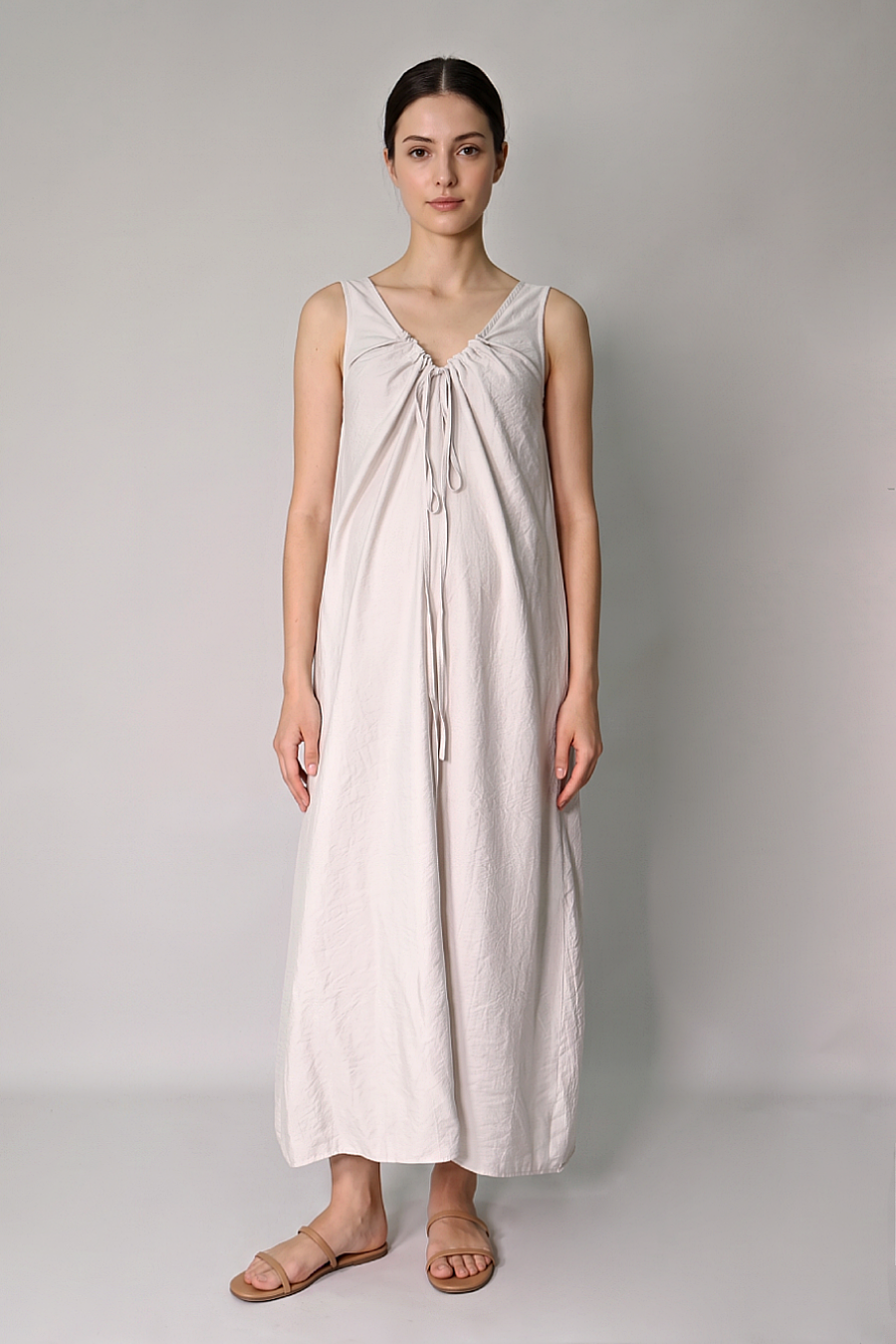 Ruched drawstring neckline detail on beige maternity maxi dress front 