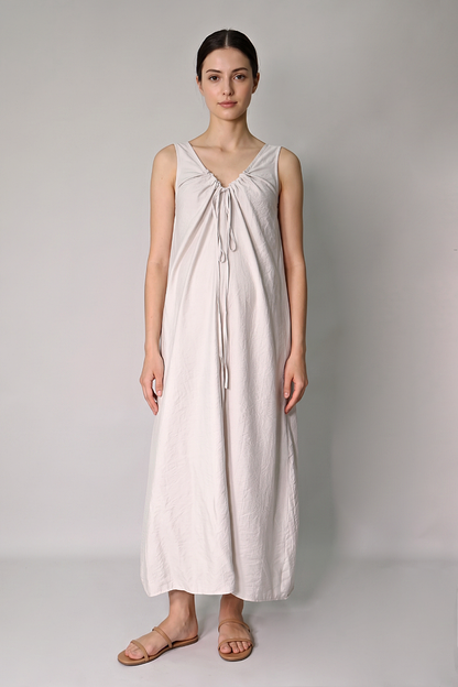 Ruched drawstring neckline detail on beige maternity maxi dress front 